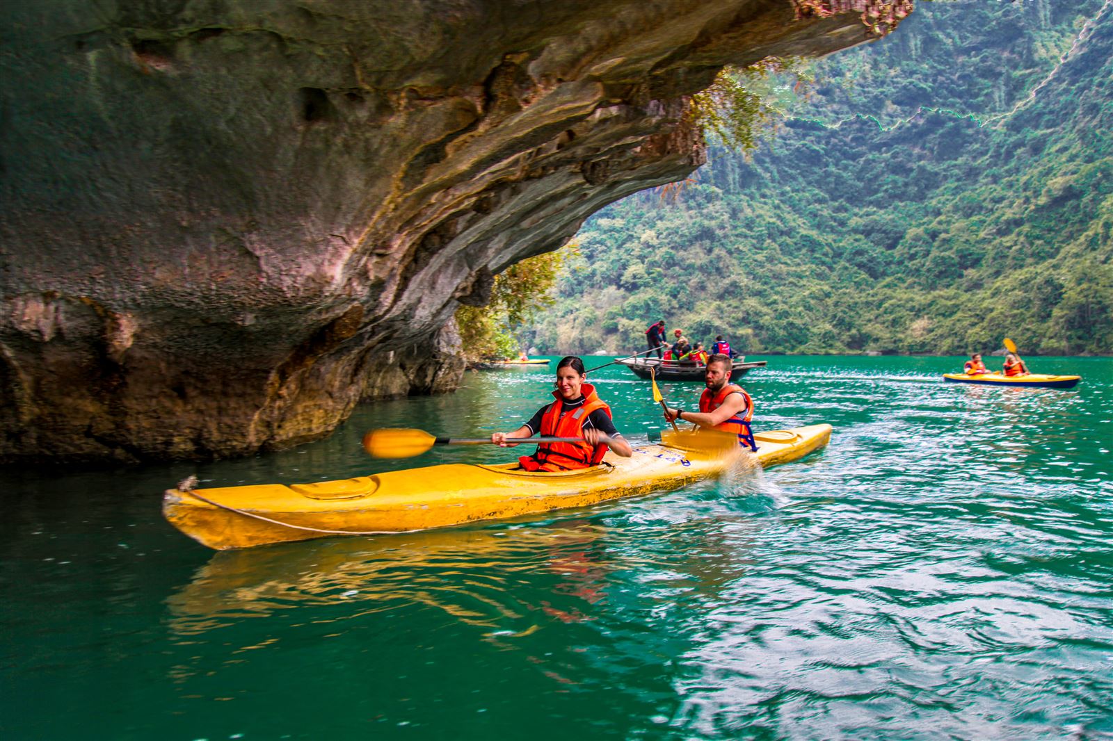 Kayak through tunnel caves