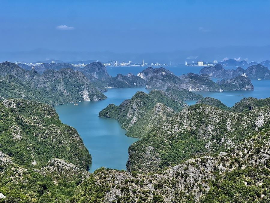 a day and night Sunset trip on Lan Ha Bay  to Viet Hai ancient village then climb up to Navy peak to view Ha Long Bay